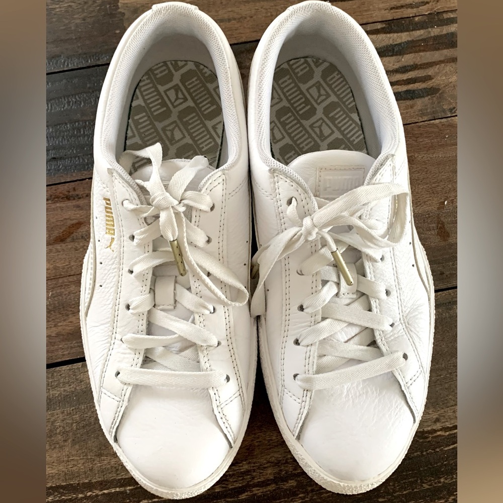 Puma Leather tennis shoes.